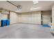 Spacious three-car garage with ample storage cabinets and epoxy flooring at 8199 Pinnacle Peak Ave, Las Vegas, NV 89113