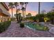 Resort style pool with lush tropical plants and landscape for backyard privacy at 8199 Pinnacle Peak Ave, Las Vegas, NV 89113