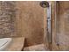 Spa-like shower featuring stone tile work and modern fixtures at 8199 Pinnacle Peak Ave, Las Vegas, NV 89113