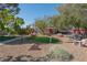 Landscaped backyard with putting green and seating at 836 San Eduardo Ave, Henderson, NV 89002