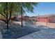 Horse stables and exercise area with red barns at 836 San Eduardo Ave, Henderson, NV 89002