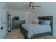 Bright bedroom with wood flooring, ceiling fan, and a dresser at 836 San Eduardo Ave, Henderson, NV 89002