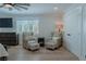 Relaxing bedroom with two armchairs, ottoman, and wood floors at 836 San Eduardo Ave, Henderson, NV 89002