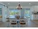 Dining area with sliding glass doors leading to the pool at 836 San Eduardo Ave, Henderson, NV 89002