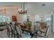 Open dining room with chandelier and view to kitchen at 836 San Eduardo Ave, Henderson, NV 89002