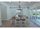 Bright dining room with farmhouse table and sliding barn doors at 836 San Eduardo Ave, Henderson, NV 89002