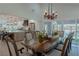 Elegant dining room with a large table and access to kitchen at 836 San Eduardo Ave, Henderson, NV 89002