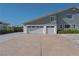 Three-car garage with white doors and concrete flooring at 836 San Eduardo Ave, Henderson, NV 89002