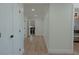 Hallway with light walls, wood floors, and closet at 836 San Eduardo Ave, Henderson, NV 89002