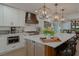 Updated kitchen with white cabinets and quartz countertops at 836 San Eduardo Ave, Henderson, NV 89002