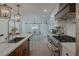 Modern kitchen with white cabinets and a large island at 836 San Eduardo Ave, Henderson, NV 89002