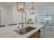 Kitchen island with farmhouse sink and marble countertop at 836 San Eduardo Ave, Henderson, NV 89002