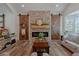 Spacious living room features a stone fireplace and barn doors at 836 San Eduardo Ave, Henderson, NV 89002