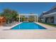 Inviting pool with pergola, lounge chairs, and lush landscaping at 836 San Eduardo Ave, Henderson, NV 89002