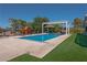 Resort-style pool area with pergola and grassy lawn at 836 San Eduardo Ave, Henderson, NV 89002