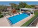 Inviting swimming pool with a pergola and lounge chairs at 836 San Eduardo Ave, Henderson, NV 89002