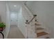 Elegant staircase with distressed white railing and wood steps at 836 San Eduardo Ave, Henderson, NV 89002