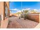 Small, paved patio and gravel backyard with desert landscaping at 8672 Big Sagebrush Ave, Las Vegas, NV 89117