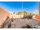 Landscaped backyard with gravel, small plants, and a birdbath at 8672 Big Sagebrush Ave, Las Vegas, NV 89117