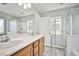 Bathroom boasts double sinks, a shower, and modern vanity at 8672 Big Sagebrush Ave, Las Vegas, NV 89117