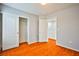 Bedroom with wood-look floors and double door closet at 8672 Big Sagebrush Ave, Las Vegas, NV 89117