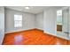 Simple bedroom with hardwood floors and an ensuite bathroom at 8672 Big Sagebrush Ave, Las Vegas, NV 89117