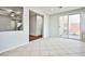 Bright dining area with tile floors and sliding glass door access to backyard at 8672 Big Sagebrush Ave, Las Vegas, NV 89117