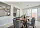 Bright dining room with wood table and access to backyard at 8672 Big Sagebrush Ave, Las Vegas, NV 89117