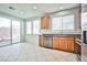 Modern kitchen featuring wood cabinets and stainless steel appliances at 8672 Big Sagebrush Ave, Las Vegas, NV 89117