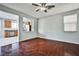 Living room features hardwood floors, a ceiling fan, and an open concept design at 8672 Big Sagebrush Ave, Las Vegas, NV 89117