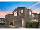 Two-story house with attached garage and landscaped front yard at 1036 Campo Seco Ct, Las Vegas, NV 89138