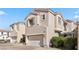 Exterior view of two-story home with attached garage at 1036 Campo Seco Ct, Las Vegas, NV 89138