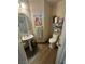 Small bathroom with pedestal sink, toilet and decorative accents at 11173 Varedo Ct, Las Vegas, NV 89141