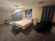 Primary bedroom with king bed, ceiling fan, and armchair at 11173 Varedo Ct, Las Vegas, NV 89141