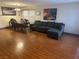 Spacious living room with hardwood floors, and dining area at 11173 Varedo Ct, Las Vegas, NV 89141