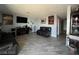 Living area with gray floors, a fireplace and two sofas at 1152 Miller Ave, Las Vegas, NV 89106