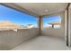 Outdoor balcony view of the neighboring house and desert landscape at 11560 Observation Point Ave, Las Vegas, NV 89138