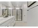 Modern bathroom with double vanity and large walk-in shower at 11560 Observation Point Ave, Las Vegas, NV 89138