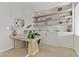 Inviting home office with a modern desk, built-in shelving, and natural light at 11560 Observation Point Ave, Las Vegas, NV 89138