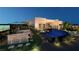 Outdoor kitchen and expansive pool with fire pit at 129 Still Shores St, Henderson, NV 89011