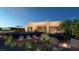 Relaxing backyard oasis with fire pit and lounge chairs at 129 Still Shores St, Henderson, NV 89011