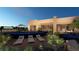 Modern home with a sleek, infinity-edge pool and relaxing lounge area at 129 Still Shores St, Henderson, NV 89011