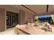 Open concept dining area with wine storage and view to backyard at 129 Still Shores St, Henderson, NV 89011
