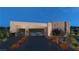 Modern home exterior with a two-car garage and landscaped front yard at 129 Still Shores St, Henderson, NV 89011
