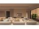 Open-concept living room with a fireplace and built-in wine storage at 129 Still Shores St, Henderson, NV 89011