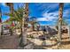Backyard featuring a seating area and palm trees at 132 Continental Ave, Henderson, NV 89015