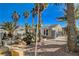 Backyard with multiple palm trees and gravel at 132 Continental Ave, Henderson, NV 89015