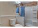 Tiled bathroom with tile flooring, white vanity, toilet, and shower-tub combo at 132 Continental Ave, Henderson, NV 89015
