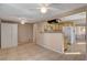 Dining room with light-colored tile floors, a ceiling fan, and an open connection to the kitchen at 132 Continental Ave, Henderson, NV 89015
