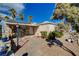 Charming home with a stone facade, brick walkway, and desert landscaping at 132 Continental Ave, Henderson, NV 89015